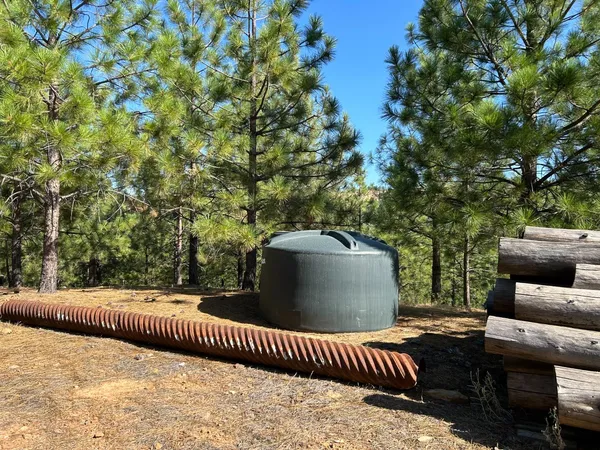 a view of balcony with couches and wooden fence