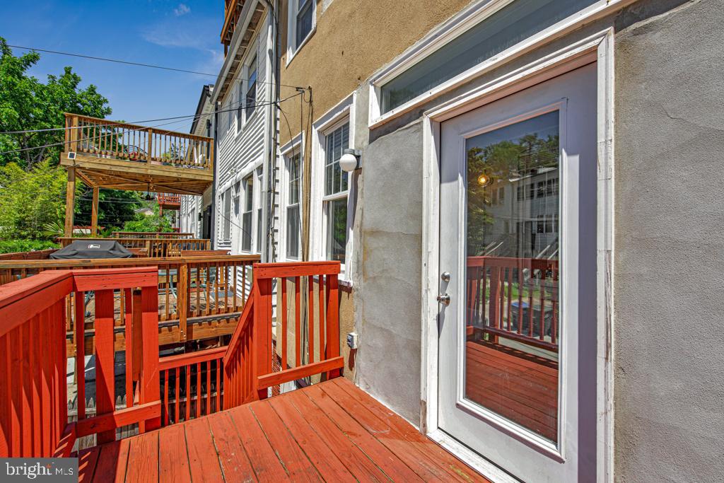2406 37th Street Northwest Washington, DC 20007 - Photo 44 of 44 a view of a wooden chairs on the balcony