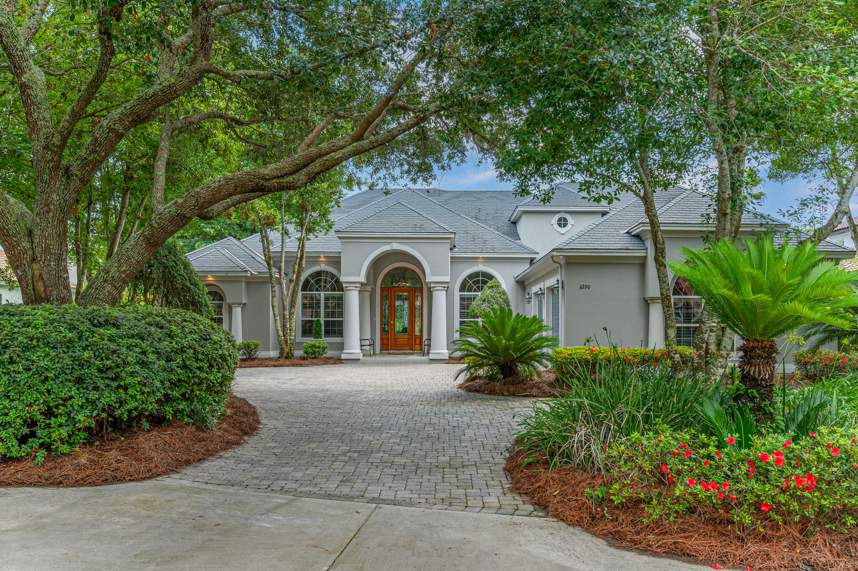 front view of a house with a garden