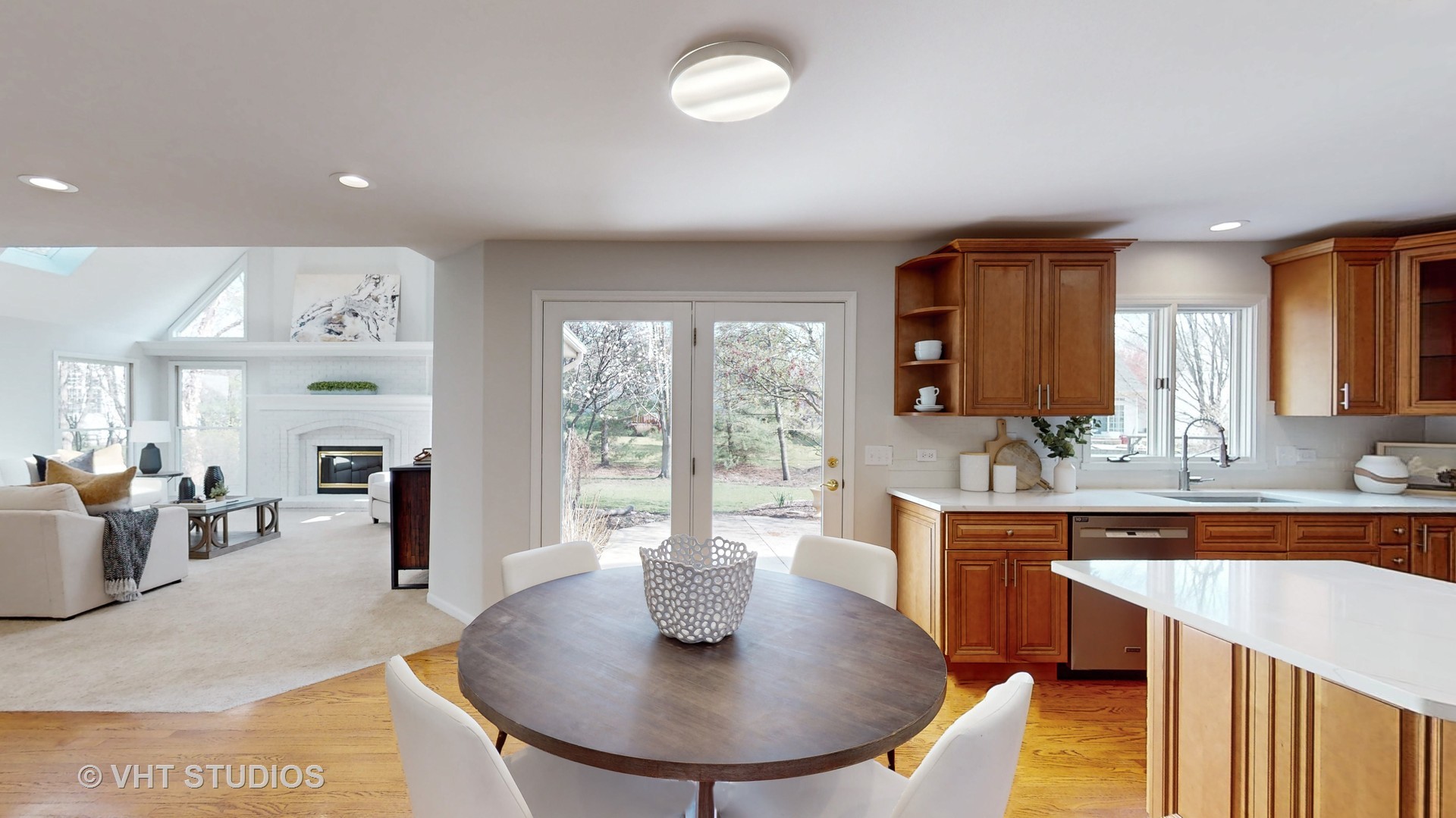 724 Sigmund Road Naperville, IL 60563 - Photo 11 of 44 a dining room with furniture a window and wooden floor