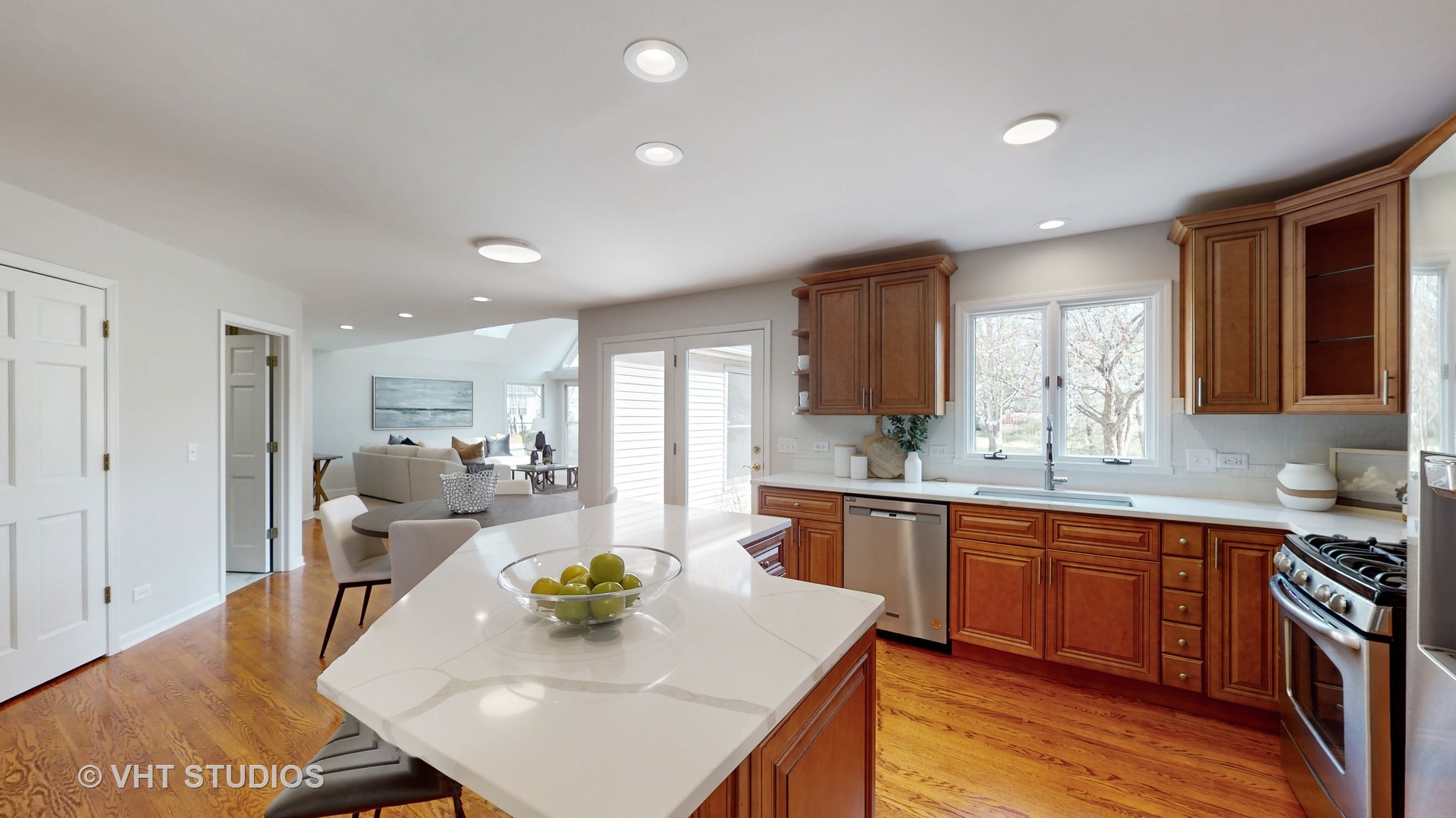724 Sigmund Road Naperville, IL 60563 - Photo 14 of 44 a large kitchen with kitchen island a sink table and chairs