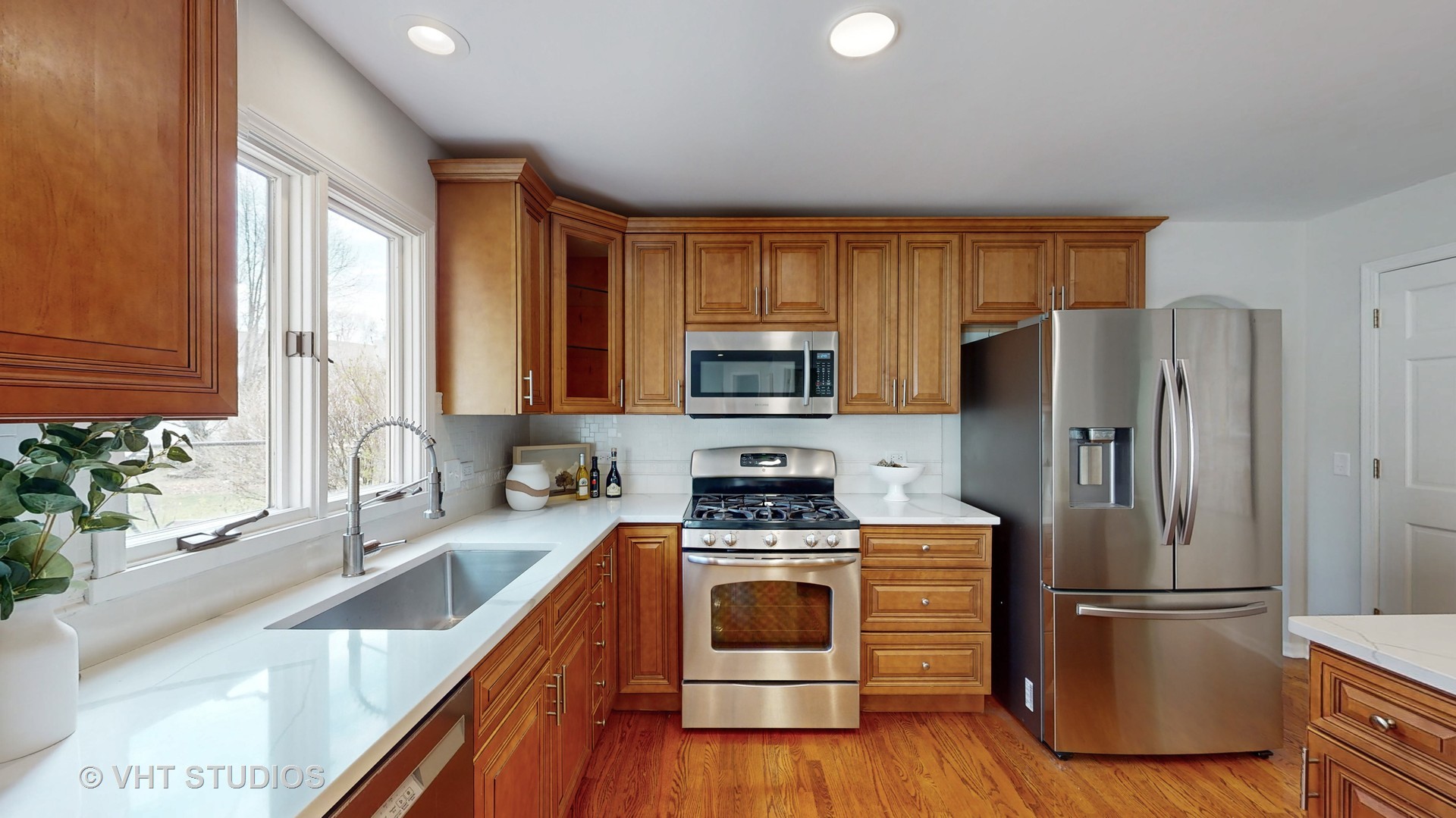 724 Sigmund Road Naperville, IL 60563 - Photo 15 of 44 a kitchen with a refrigerator a sink dishwasher stove and oven