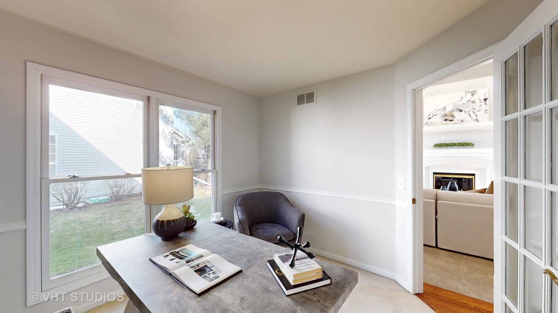 724 Sigmund Road Naperville, IL 60563 - Photo 19 of 44 a living room with a couch and a table