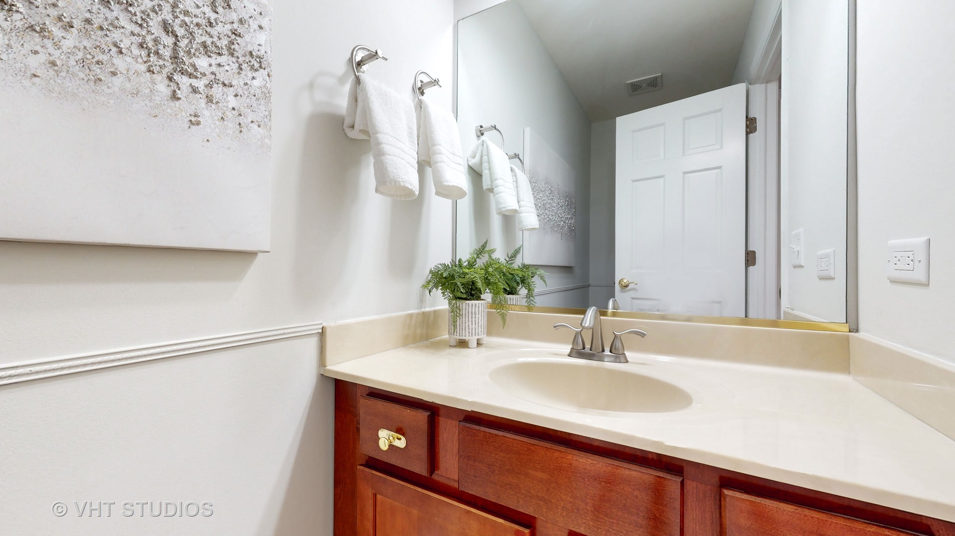 724 Sigmund Road Naperville, IL 60563 - Photo 20 of 44 a bathroom with a sink and a mirror