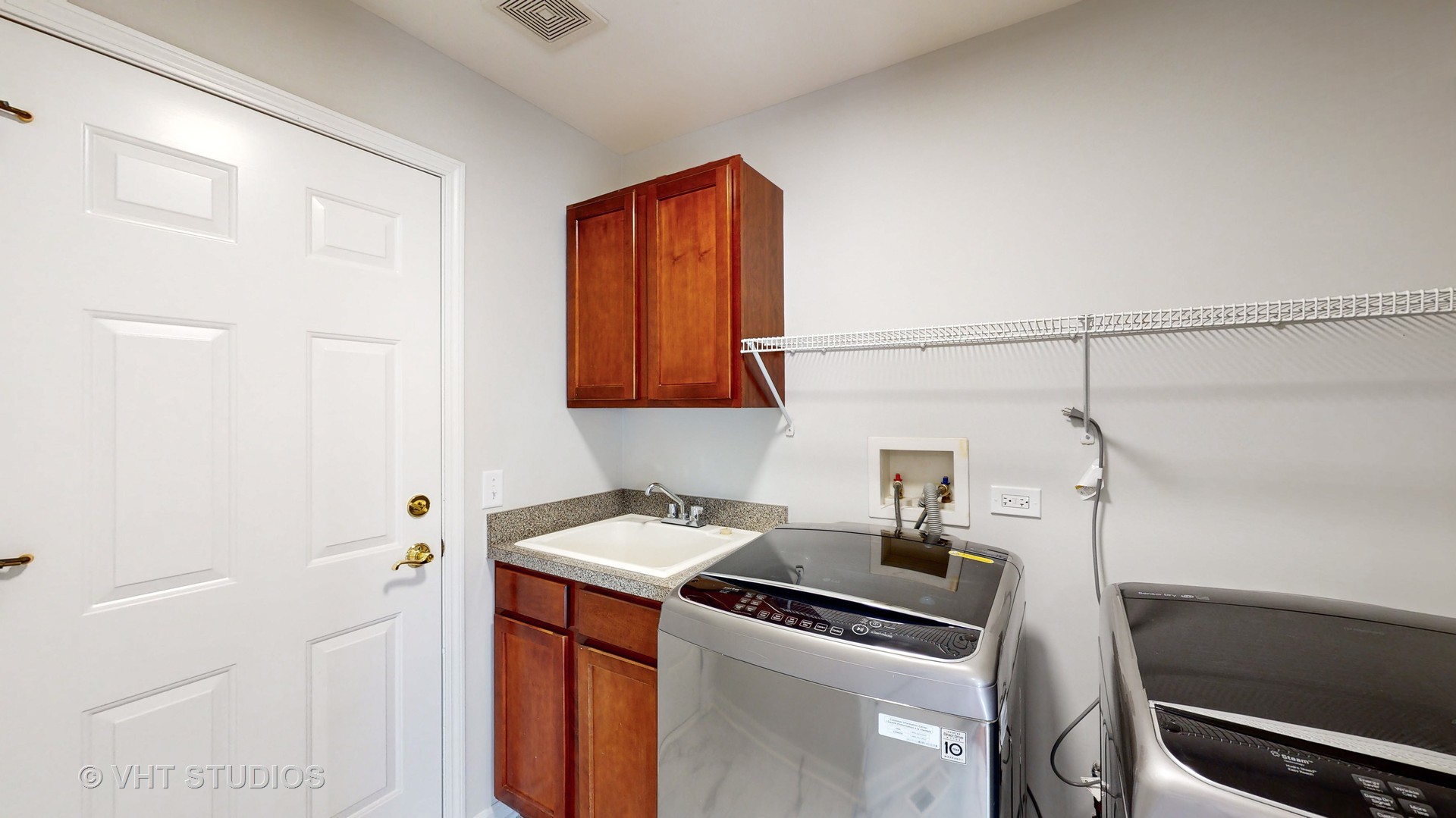 724 Sigmund Road Naperville, IL 60563 - Photo 21 of 44 a kitchen that has a sink and a stove