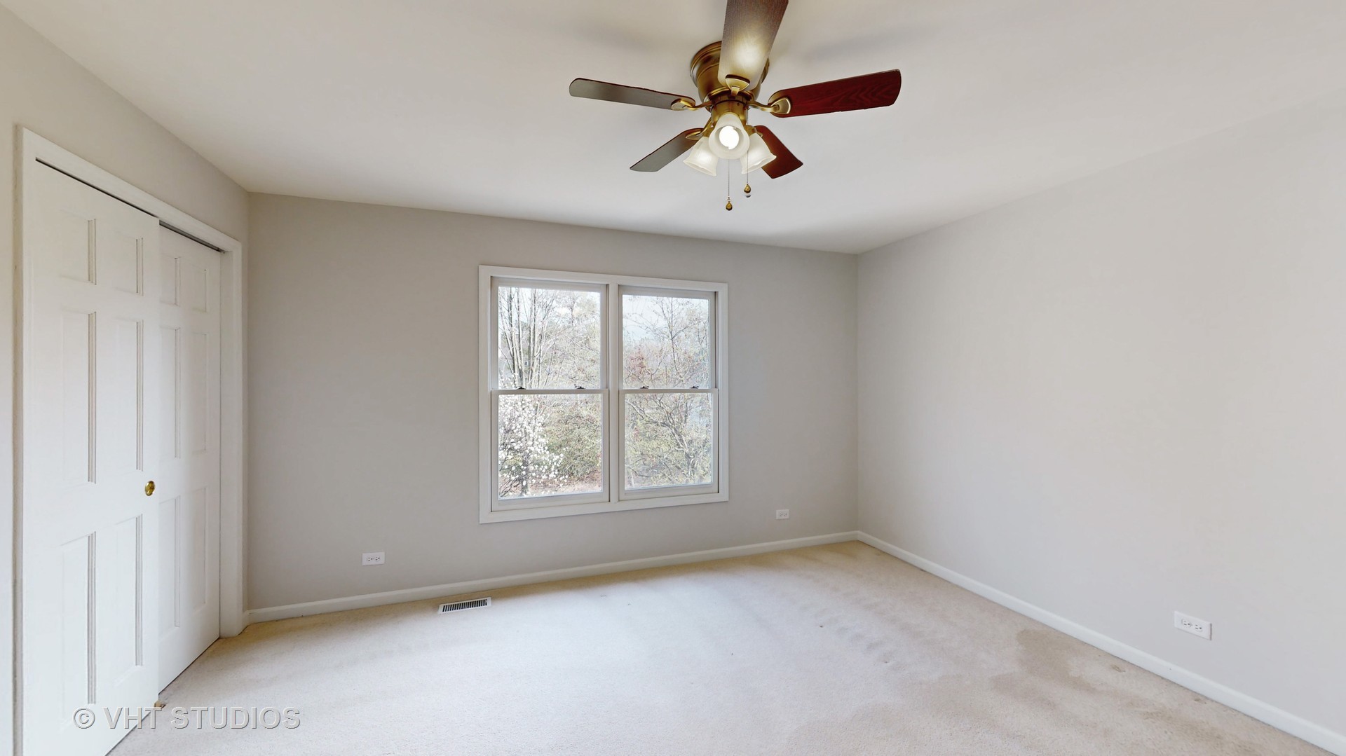 724 Sigmund Road Naperville, IL 60563 - Photo 28 of 44 an empty room with windows and fan