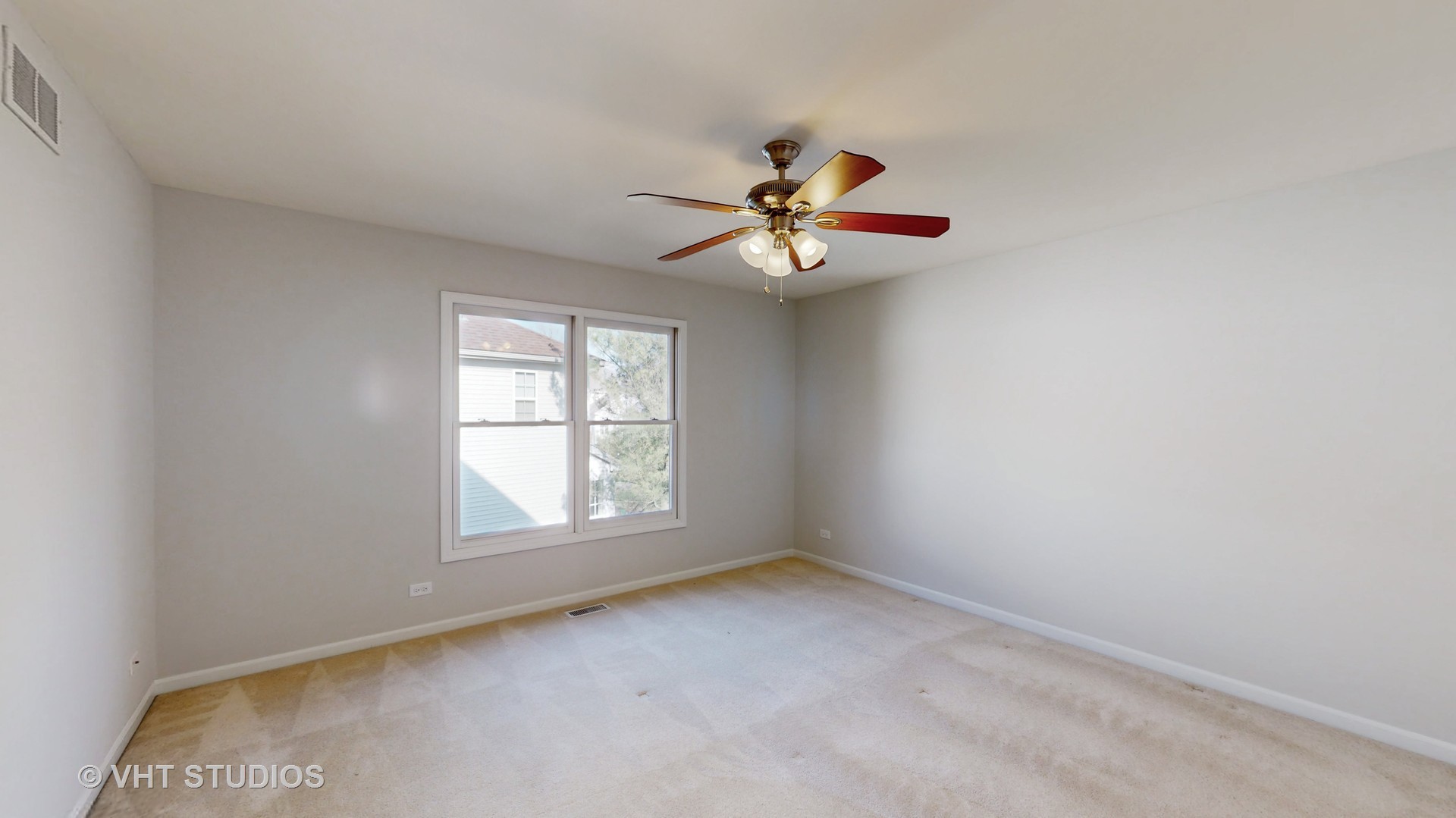 724 Sigmund Road Naperville, IL 60563 - Photo 30 of 44 an empty room with a window and a fan