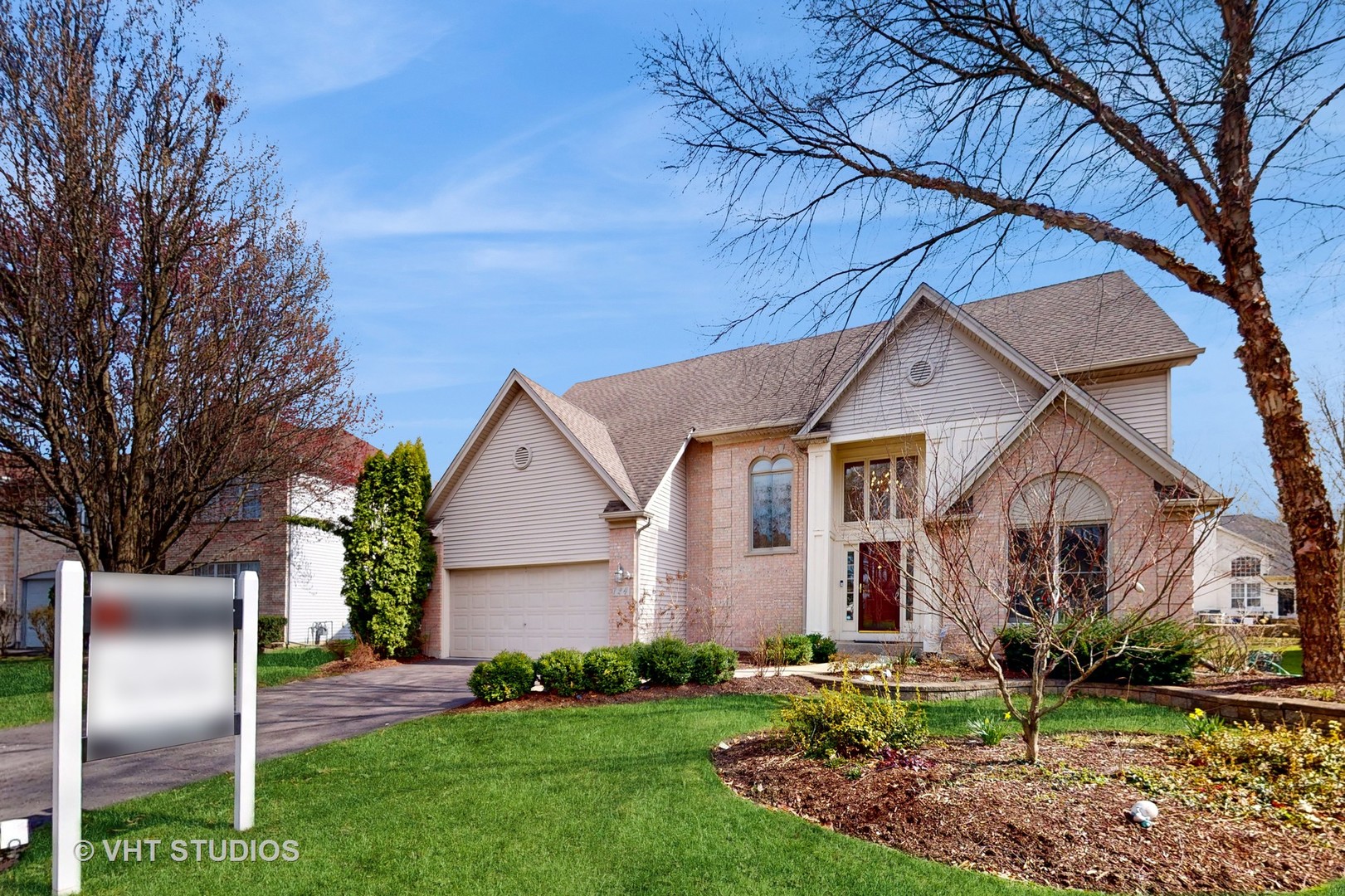 724 Sigmund Road Naperville, IL 60563 - Photo 3 of 44 a front view of a house with garden