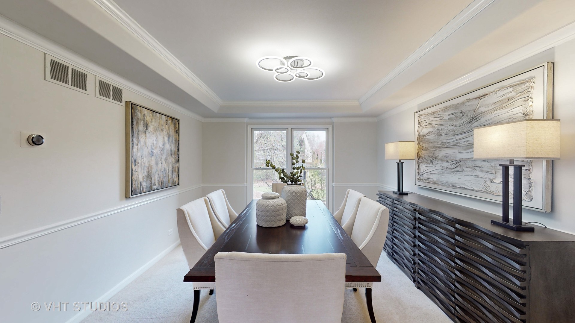 724 Sigmund Road Naperville, IL 60563 - Photo 9 of 44 a view of a dining room with furniture a chandelier and wooden floor