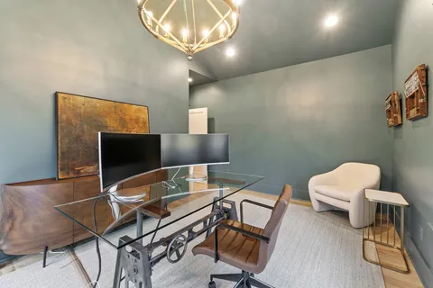 a living room with furniture fireplace and flat screen tv
