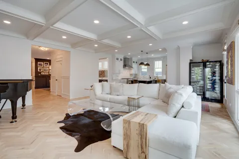 a kitchen with kitchen island granite countertop a sink a center island and stainless steel appliances
