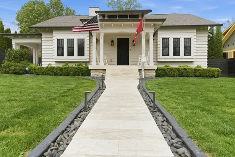 a front view of a house with a yard