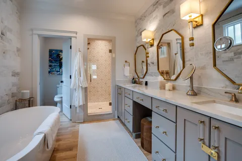 a bathroom with a shower and a bath tub