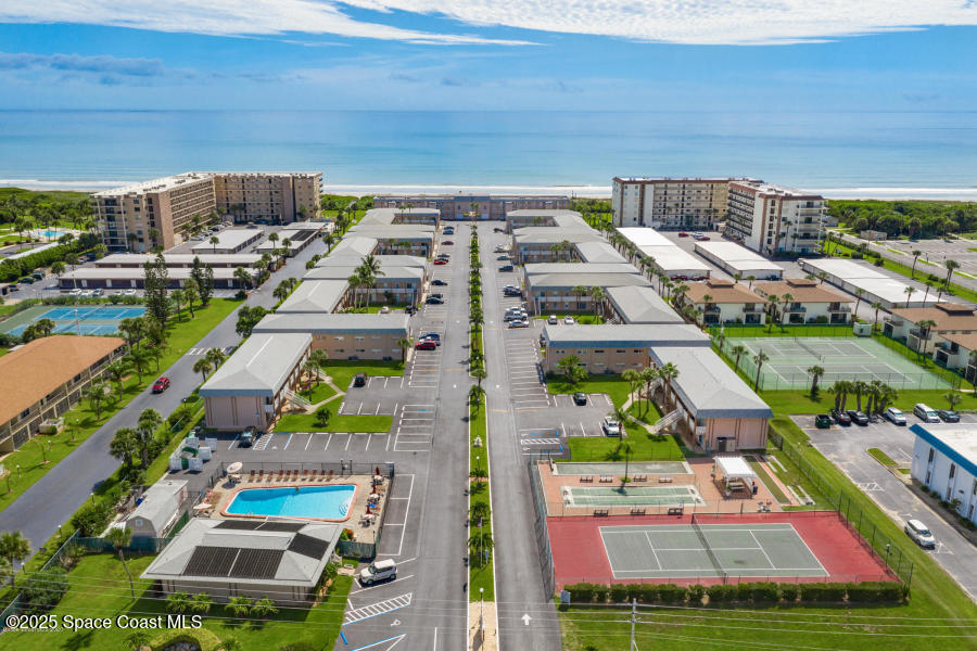 3150 North Atlantic Avenue, Unit 23330 Cocoa Beach, FL 32931 - Photo 11 of 18 a picture of aerial view of residential houses with outdoor space