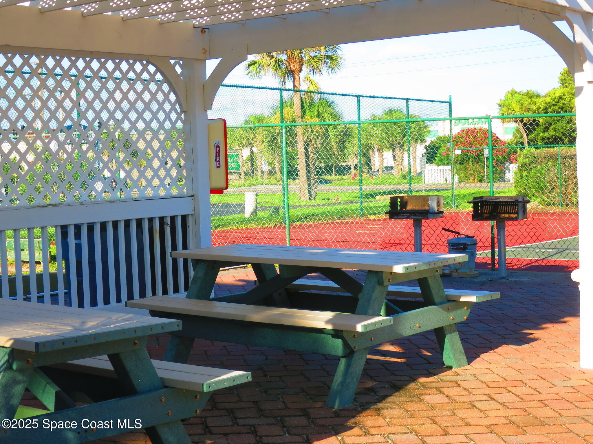 3150 North Atlantic Avenue, Unit 23330 Cocoa Beach, FL 32931 - Photo 13 of 18 a view of a yard with patio