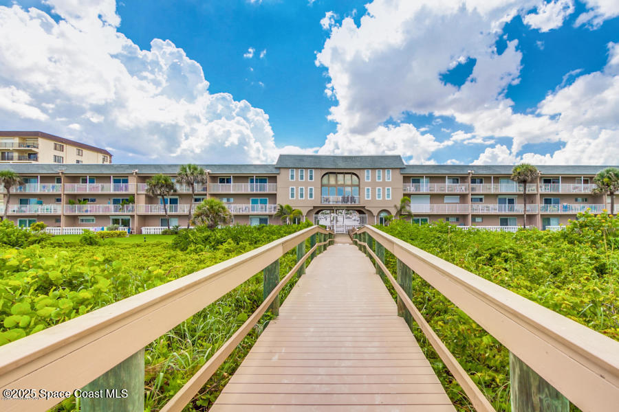 3150 North Atlantic Avenue, Unit 23330 Cocoa Beach, FL 32931 - Photo 15 of 18 a view of river and yard from a balcony