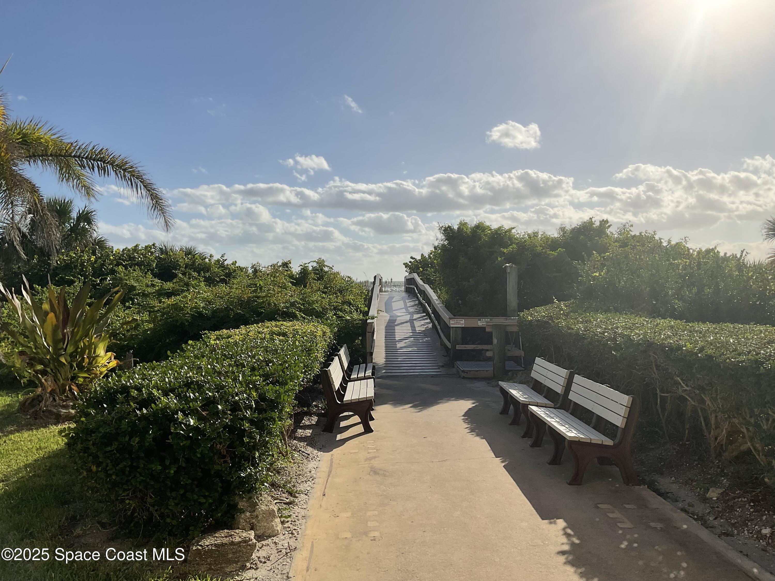 3150 North Atlantic Avenue, Unit 23330 Cocoa Beach, FL 32931 - Photo 18 of 18 a view of a terrace with a yard