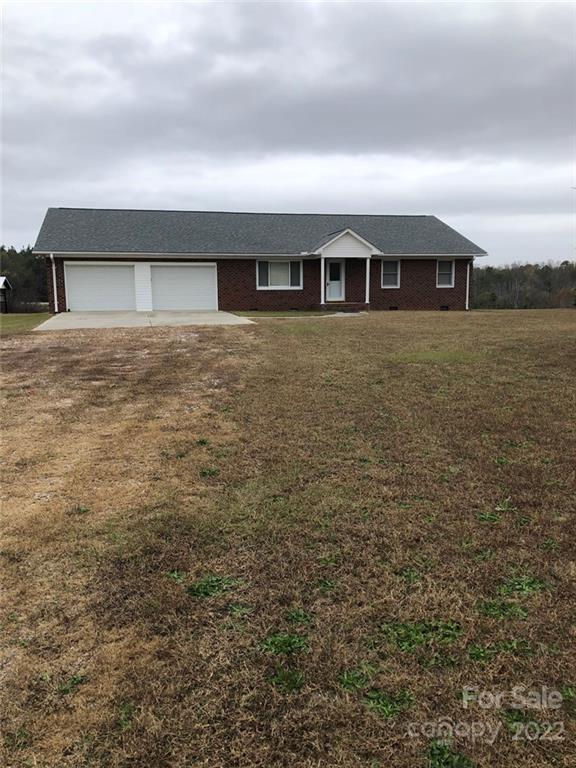 305 McCall Road Ellerbe, NC 28338 - Photo 1 of 14 a front view of house with yard