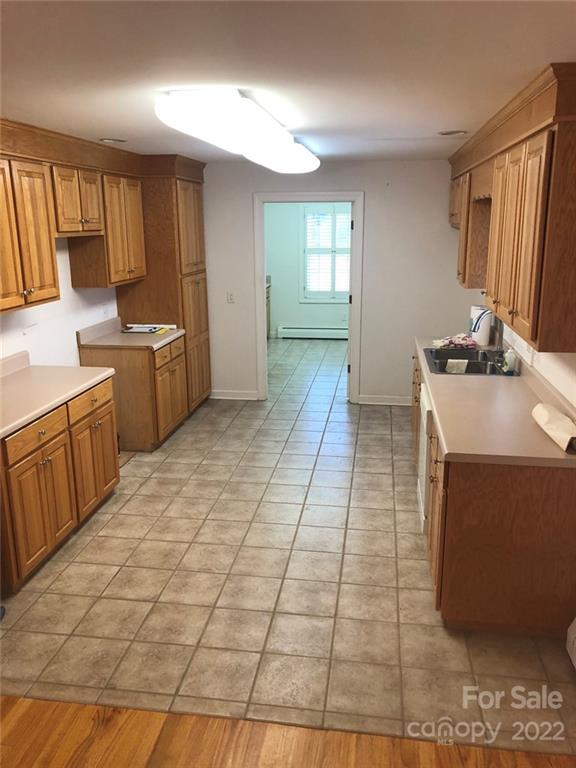 305 McCall Road Ellerbe, NC 28338 - Photo 3 of 14 a kitchen with a sink and cabinets