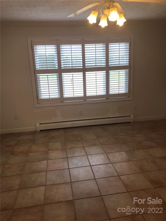 305 McCall Road Ellerbe, NC 28338 - Photo 5 of 14 a view of a livingroom with an empty space and window