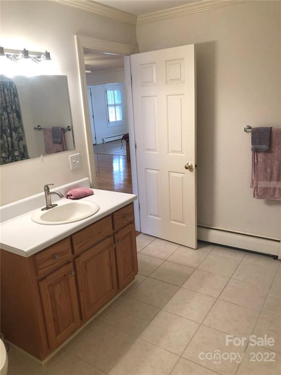 305 McCall Road Ellerbe, NC 28338 - Photo 6 of 14 a bathroom with a sink vanity and mirror