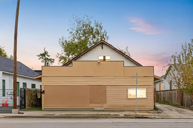 a view of a house with a iron stairs