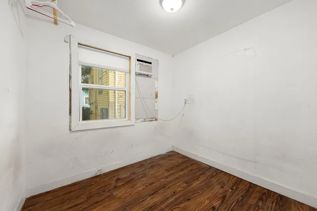 a kitchen with a refrigerator and a stove top oven