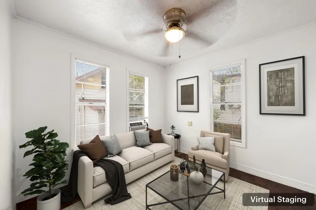 an empty room with wooden floor and cabinet