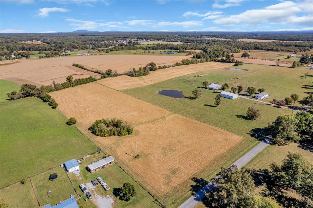 0 Charlie Crosslin Road Manchester, TN 37355 - Photo 2 of 24 an aerial view of a city with lots of residential buildings ocean and mountain view in back