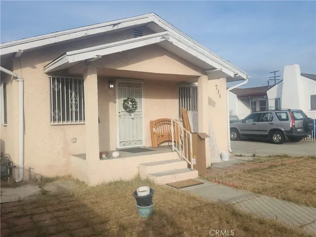 a view of parking garage with cars parked