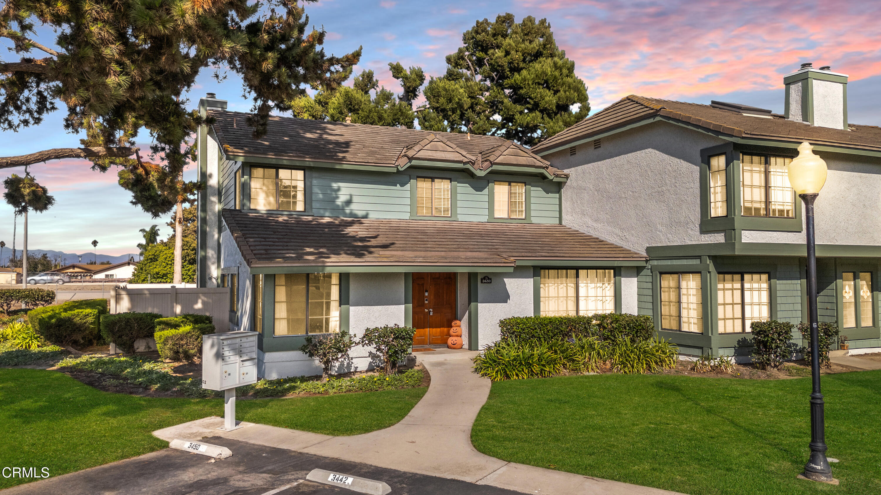 3450 Olds Road Oxnard, CA 93033 - Photo 1 of 30 a front view of a house with yard and green space