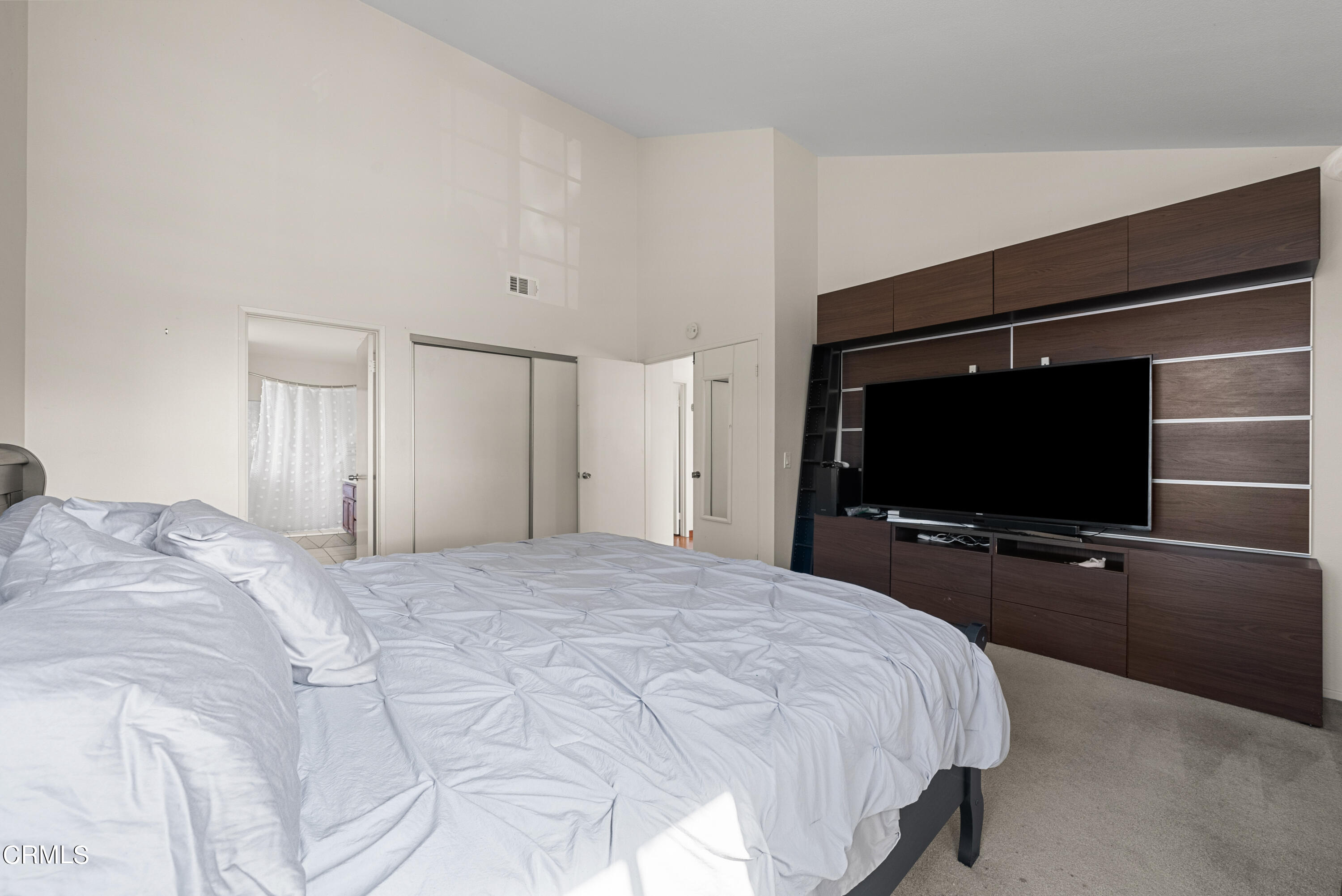 3450 Olds Road Oxnard, CA 93033 - Photo 21 of 30 a bedroom with a bed and a flat screen tv