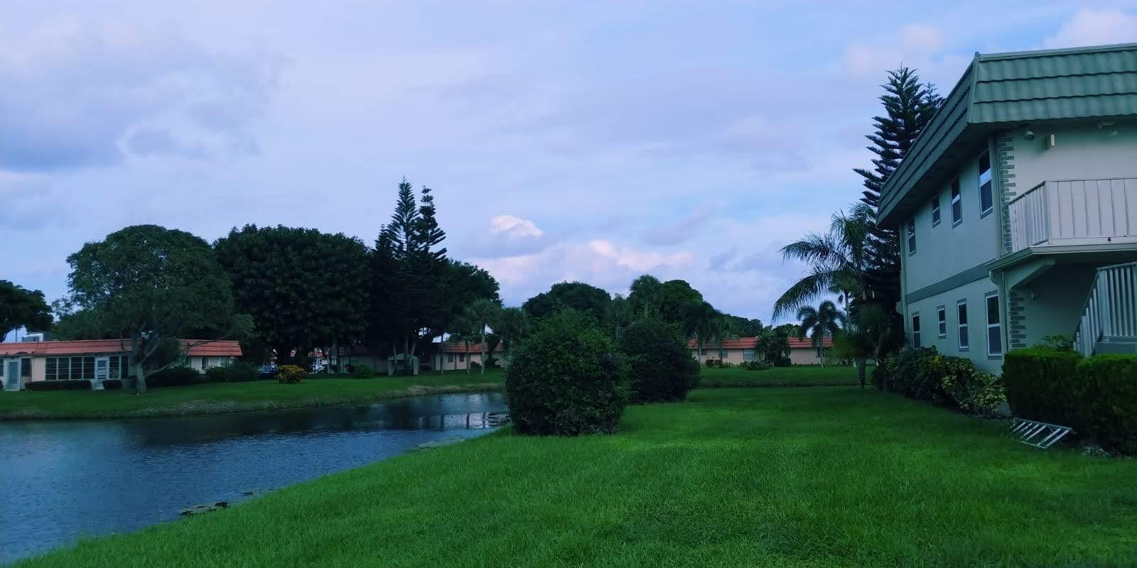 95 Monaco Boulevard, Unit B Delray Beach, FL 33446 - Photo 1 of 46 a view of a garden with houses