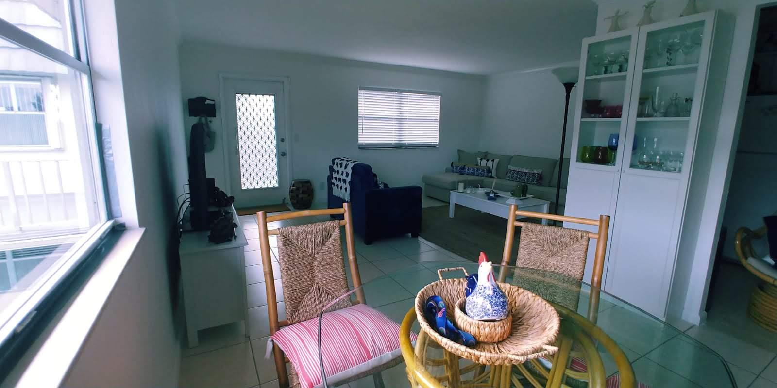 95 Monaco Boulevard, Unit B Delray Beach, FL 33446 - Photo 11 of 46 a living room with furniture and a large window