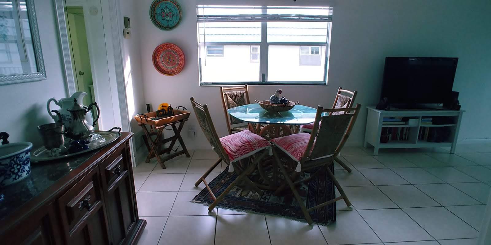 95 Monaco Boulevard, Unit B Delray Beach, FL 33446 - Photo 12 of 46 a dining room with furniture and window