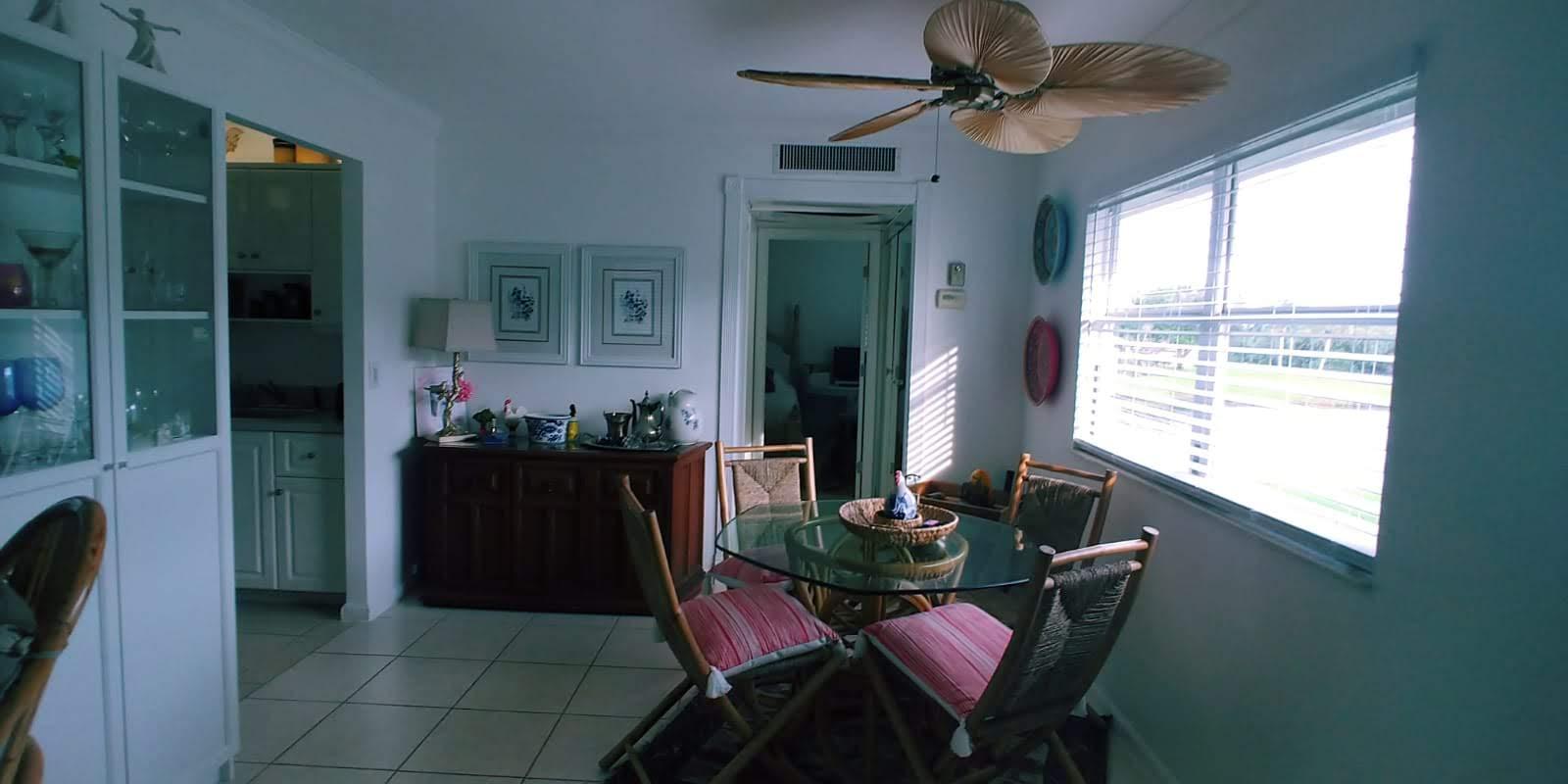 95 Monaco Boulevard, Unit B Delray Beach, FL 33446 - Photo 13 of 46 a dining room with furniture and window
