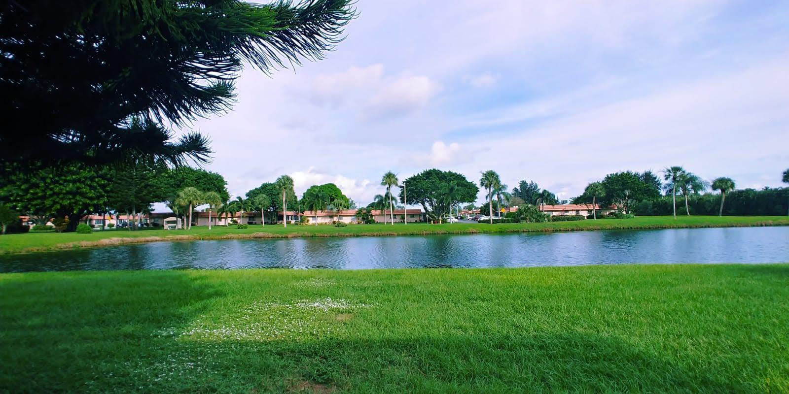 95 Monaco Boulevard, Unit B Delray Beach, FL 33446 - Photo 19 of 46 a view of a lake