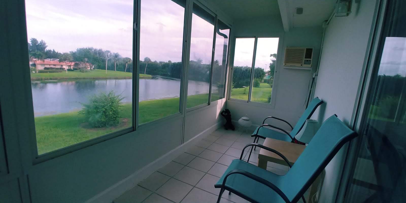 95 Monaco Boulevard, Unit B Delray Beach, FL 33446 - Photo 23 of 46 a view of a balcony with chair and table