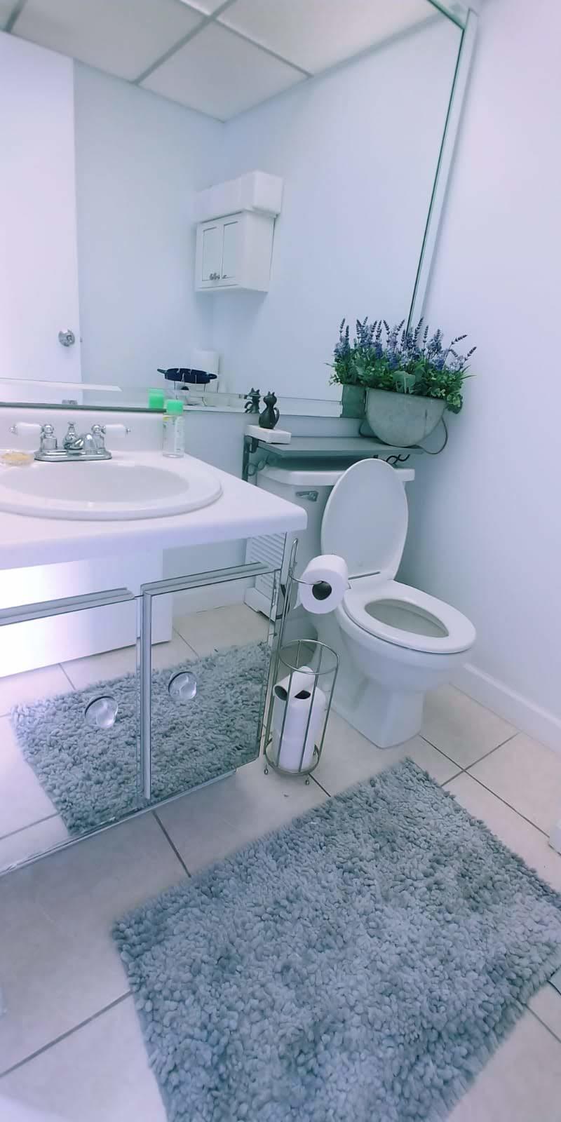 95 Monaco Boulevard, Unit B Delray Beach, FL 33446 - Photo 25 of 46 a white table sitting in a kitchen next to a window