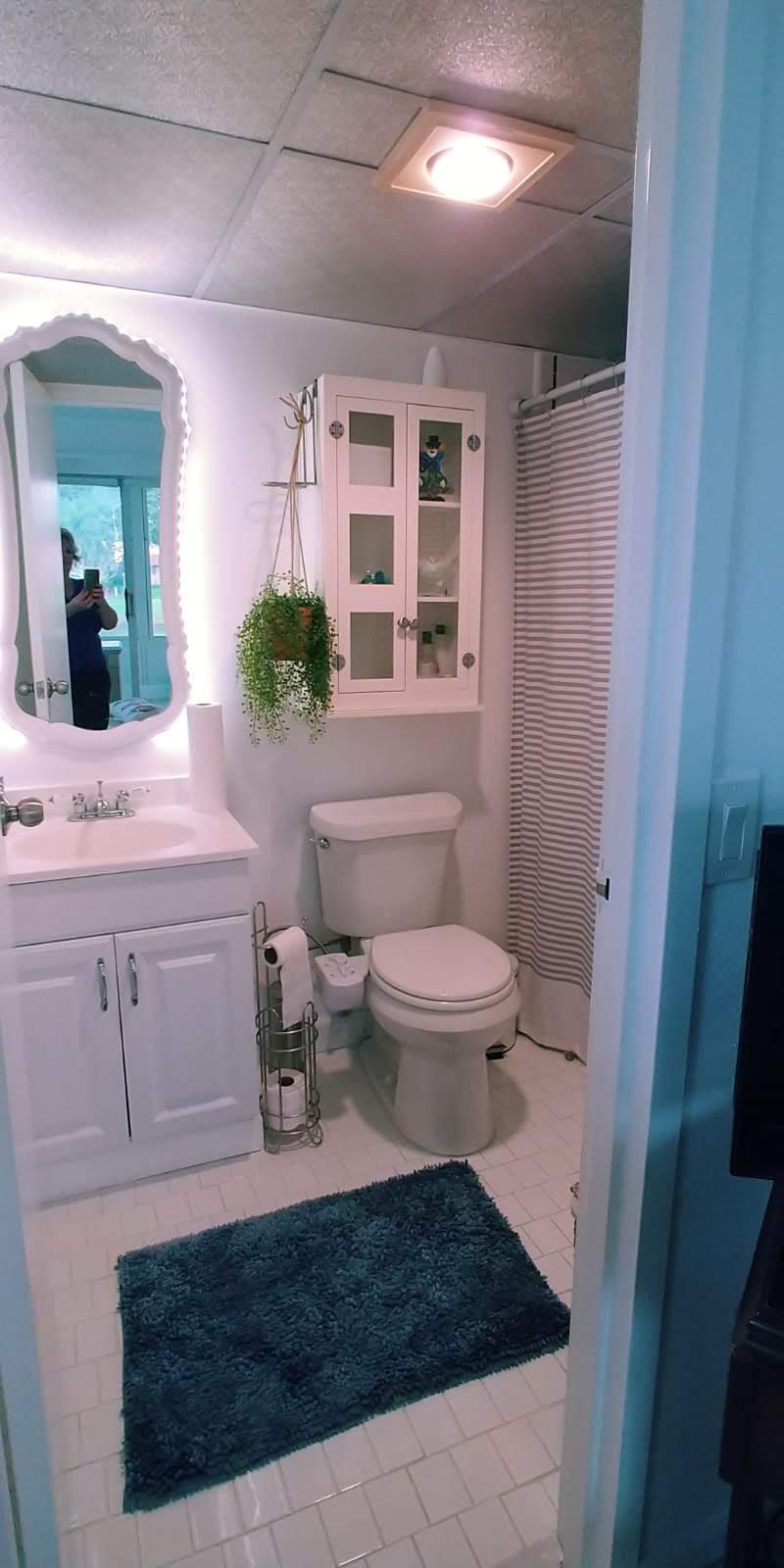 95 Monaco Boulevard, Unit B Delray Beach, FL 33446 - Photo 26 of 46 a bathroom with a sink a toilet and shower