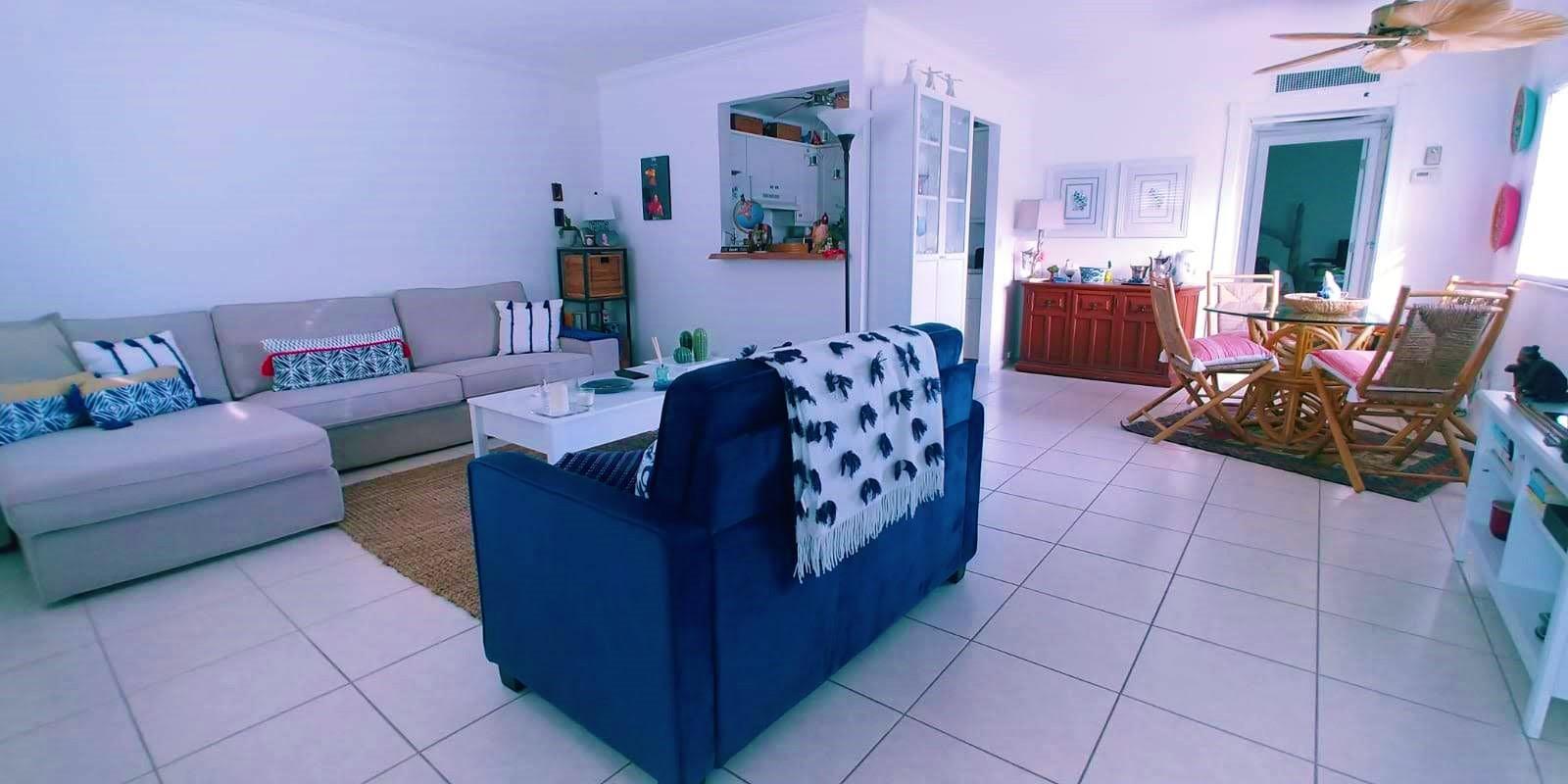 95 Monaco Boulevard, Unit B Delray Beach, FL 33446 - Photo 4 of 46 a living room with furniture and a couch