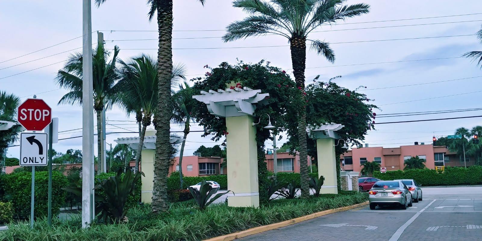 95 Monaco Boulevard, Unit B Delray Beach, FL 33446 - Photo 38 of 46 a view of a house with a yard and potted plants