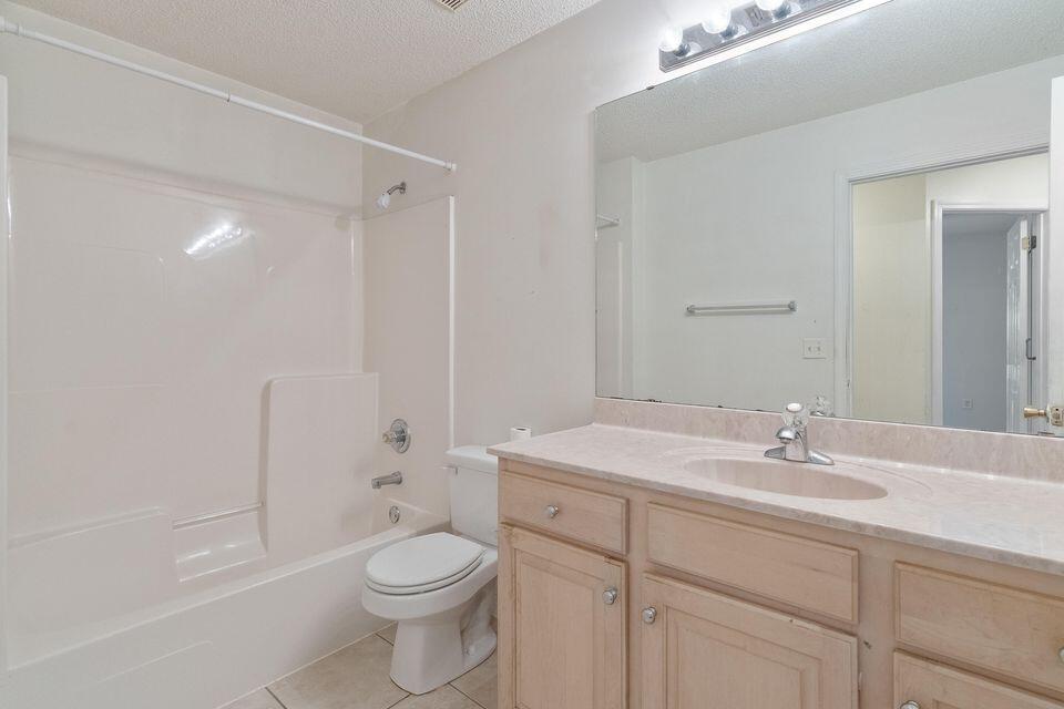 209 Warrior Street Crestview, FL 32536 - Photo 17 of 18 a bathroom with a sink a toilet and shower