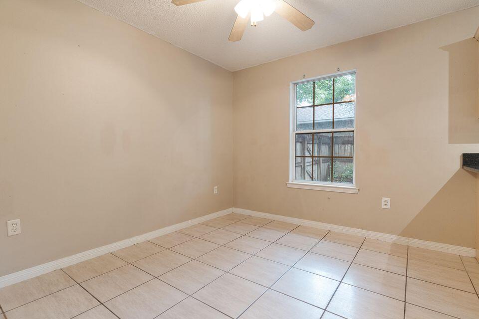 209 Warrior Street Crestview, FL 32536 - Photo 10 of 18 an empty room with windows