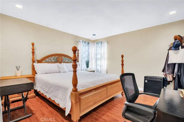 a bed room with a bed and a chair