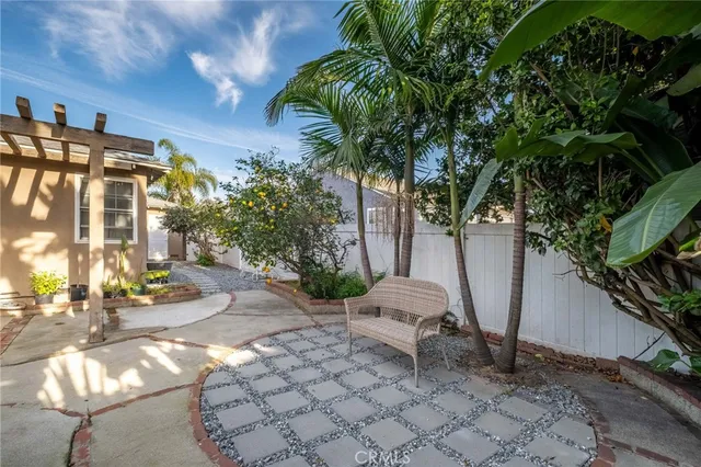 a view of a chair and tables in the patio