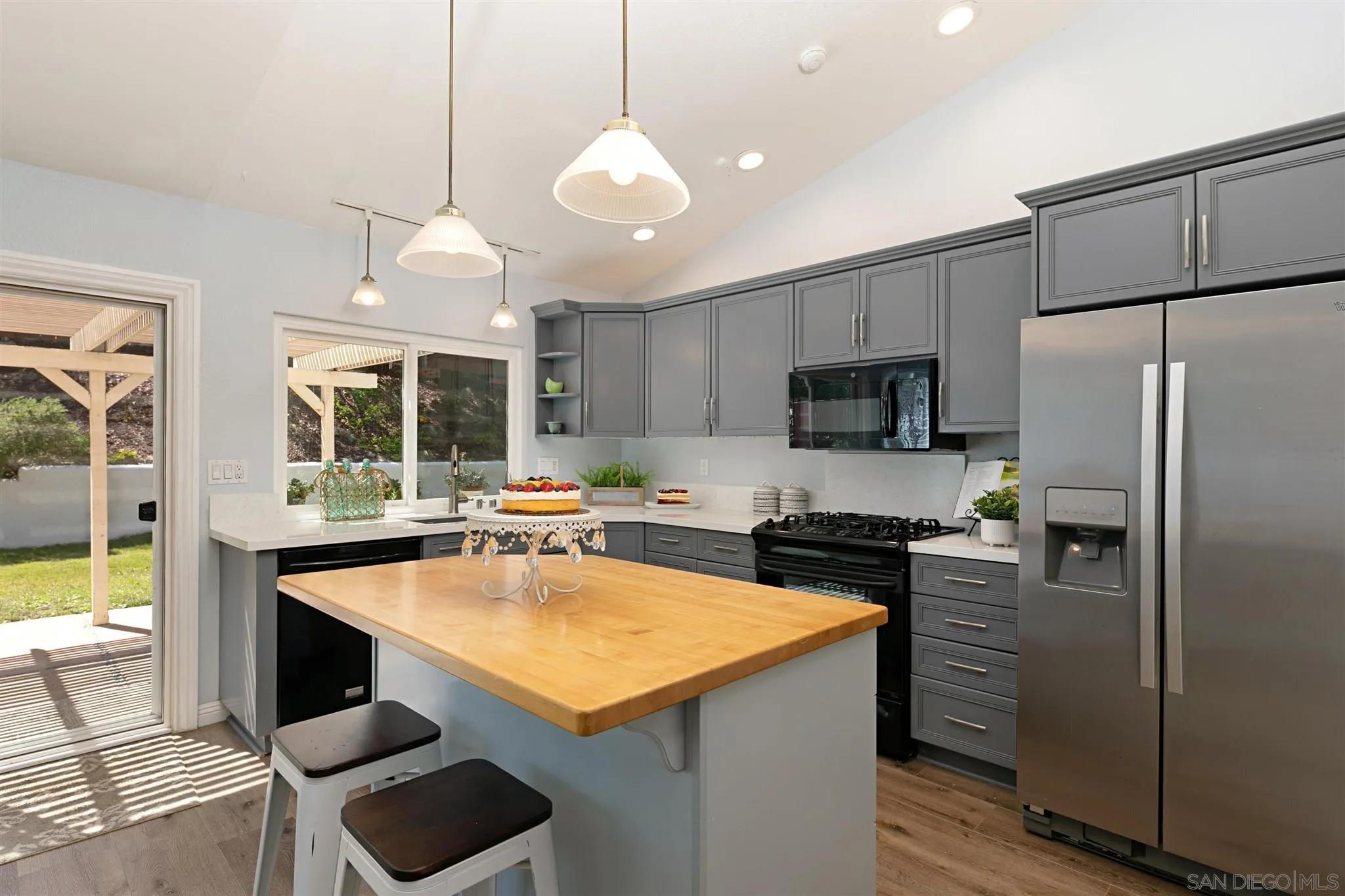 574 Gardendale Road Encinitas, CA 92024 - Photo 11 of 53 a kitchen with stainless steel appliances a stove a refrigerator and a sink