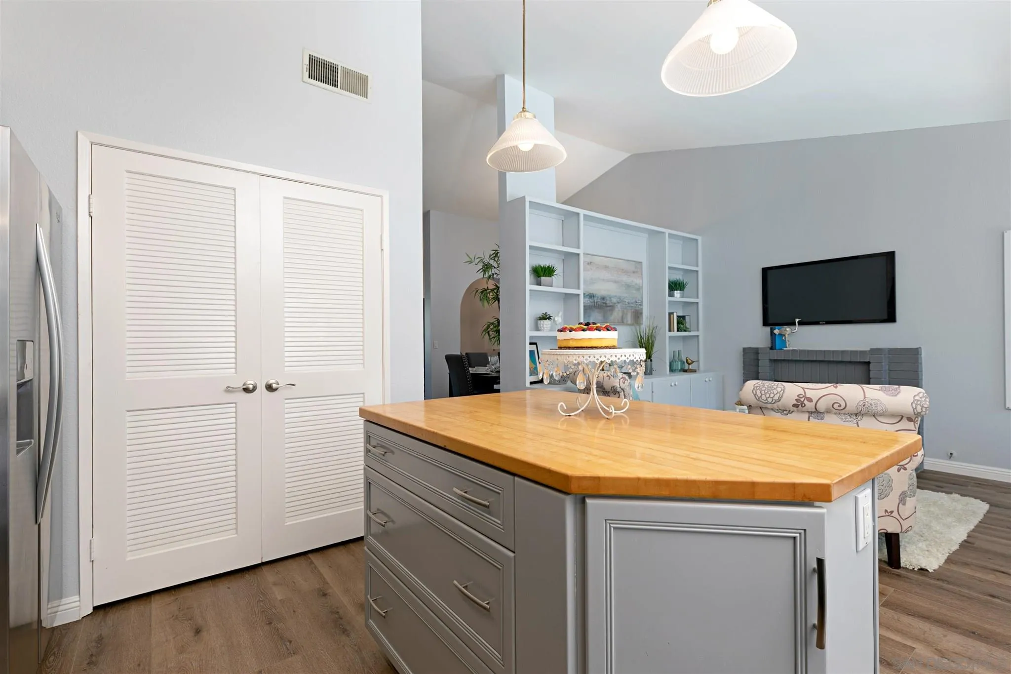 574 Gardendale Road Encinitas, CA 92024 - Photo 16 of 53 a room with kitchen island a sink and wooden floor