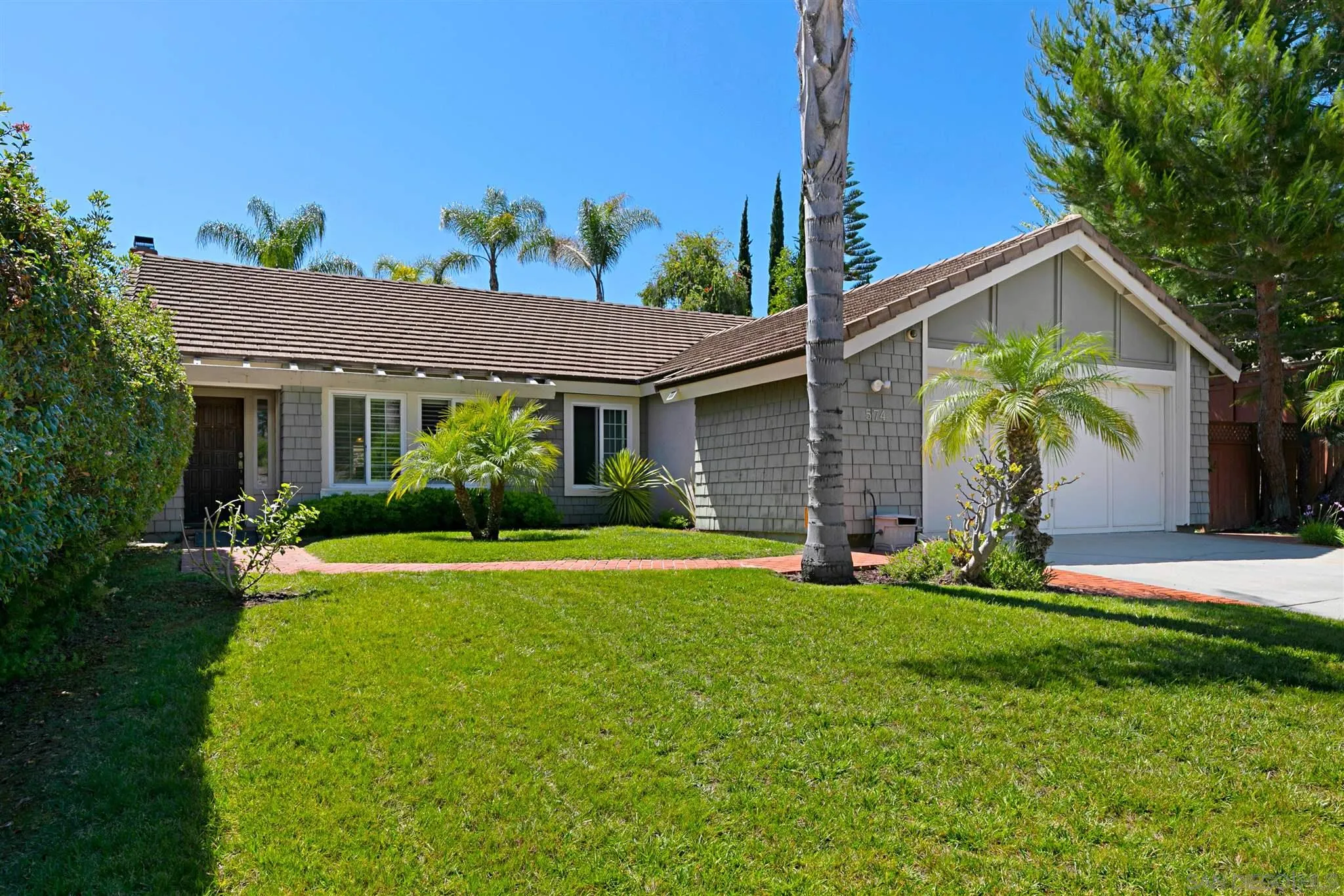 574 Gardendale Road Encinitas, CA 92024 - Photo 2 of 53 a front view of a house with garden