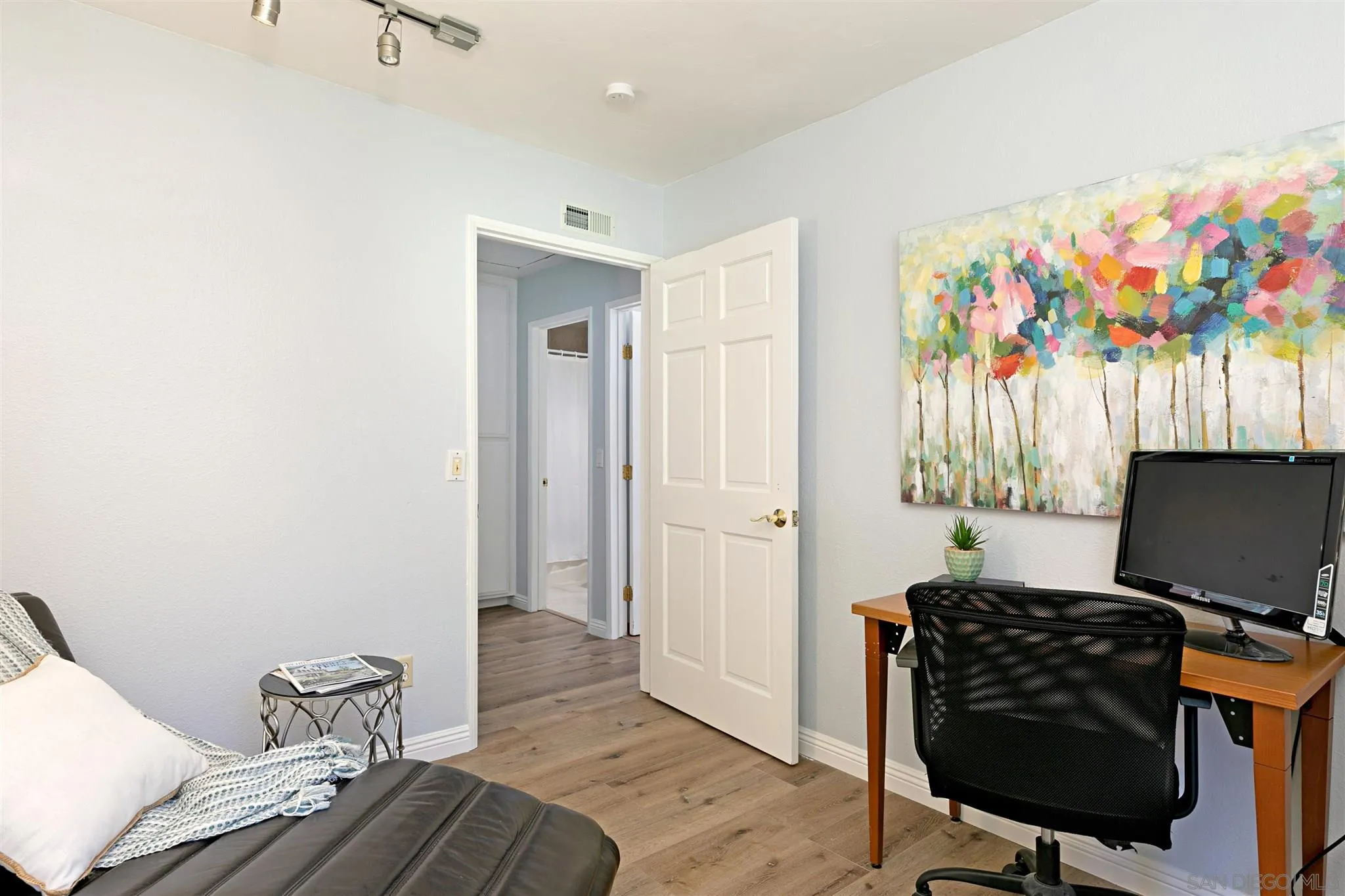 574 Gardendale Road Encinitas, CA 92024 - Photo 21 of 53 a view of a workspace with furniture and wooden floor